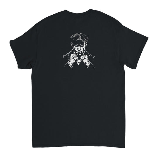 Man in fighting stance with his guard up and an intense, aggressive gaze – dynamic back print on Combat Core Gear t-shirt